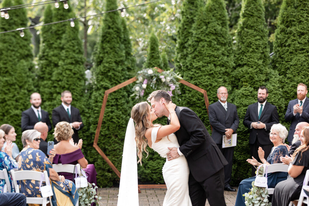 Becca & Jordan close out their wedding ceremony with a kiss!