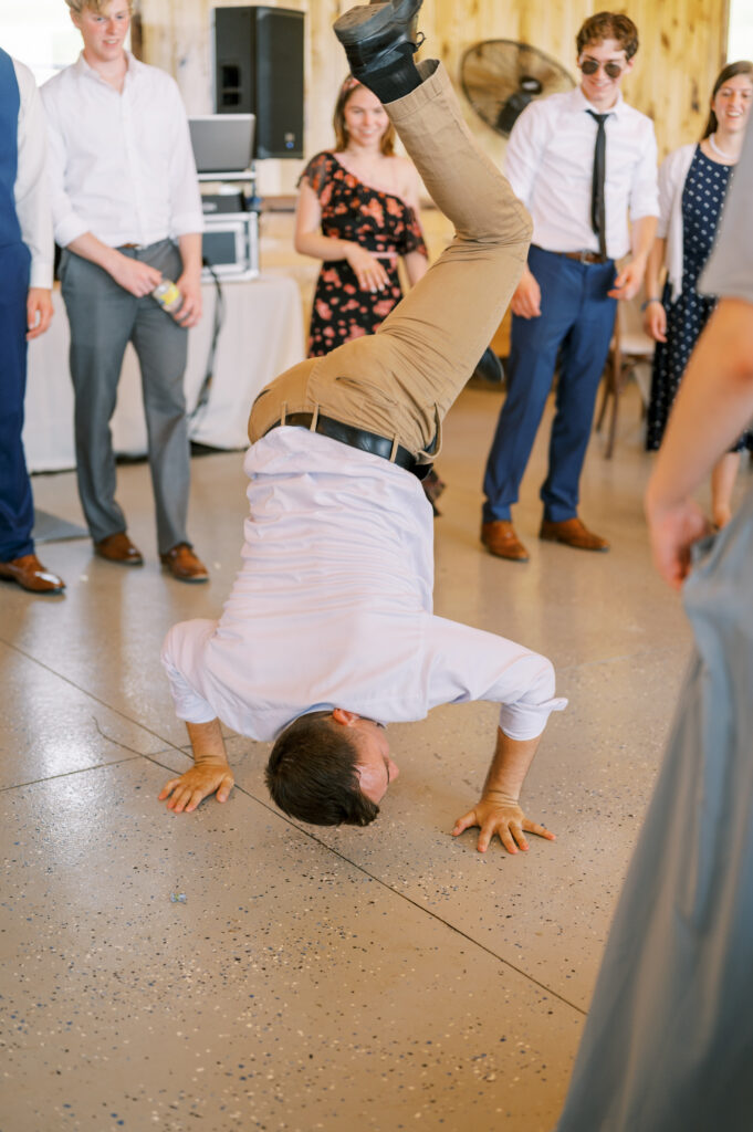 Guests gathered around for dancing at Matthew & Kate's Wedding Reception in Amsterdam, OH