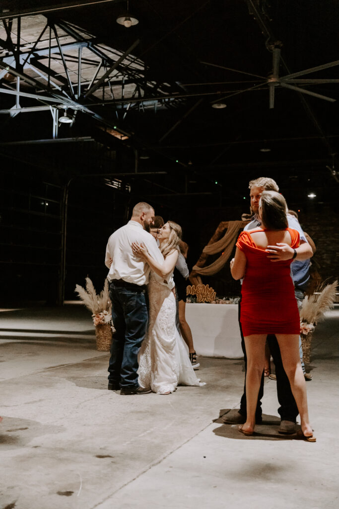 Travis & Amanda dancing with their guests at their wedding reception in Mount Vernon, Ohio