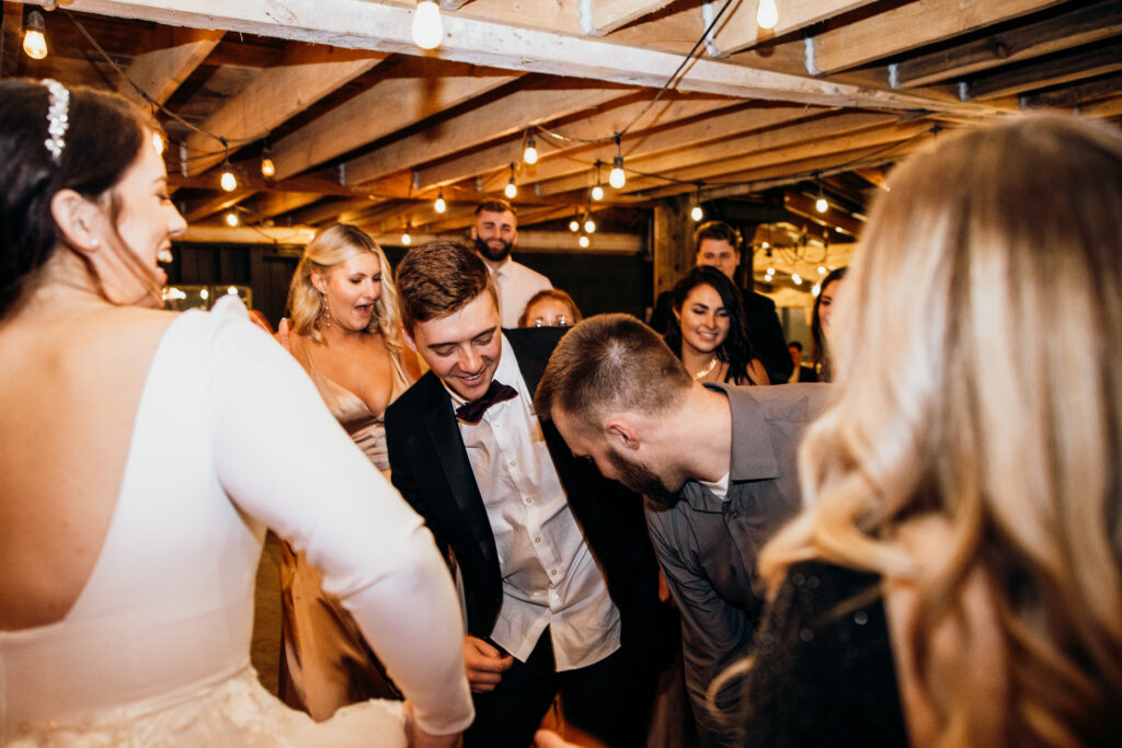 Elizabeth & Brandon dancing with their friends and family at their wedding reception in Mt. Vernon, OH