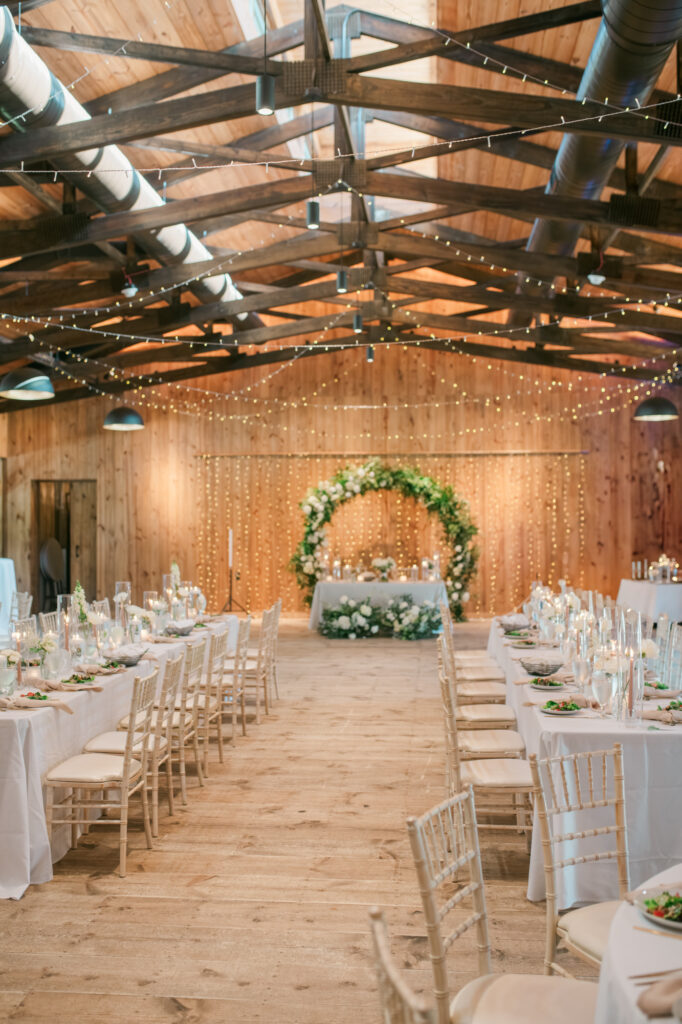 A view inside the reception space of the historic barn at Jorgensen Farms before all of the guests entered for Anna & Codey's Wedding Reception