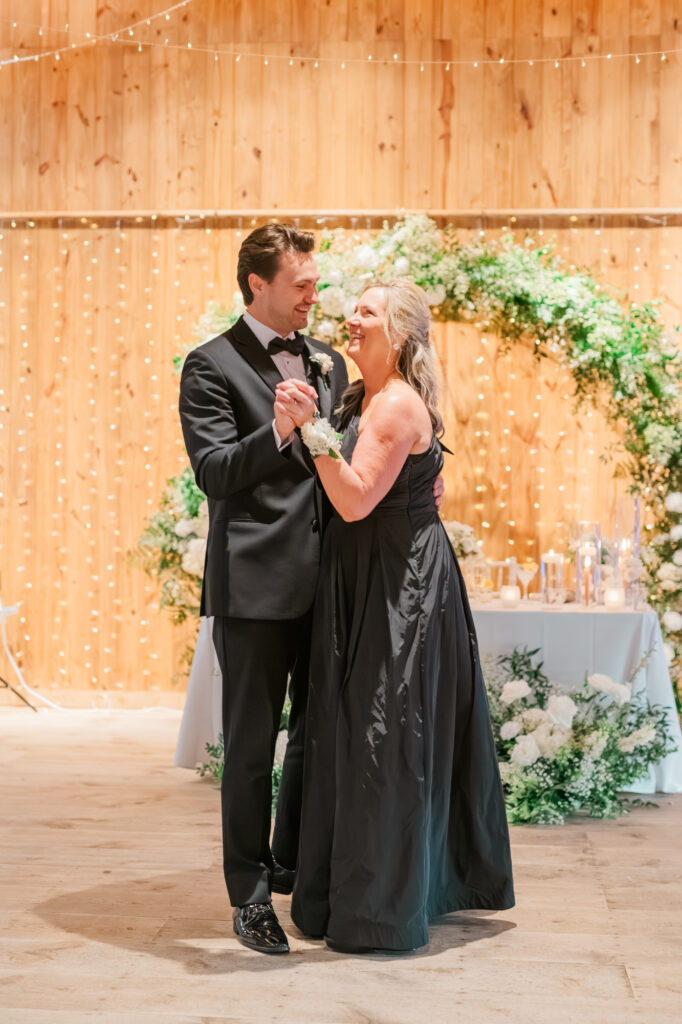 Codey & Melissa sharing a dance at his wedding reception inside the Historic Barn at Jorgensen Farms in Westerville, OH
