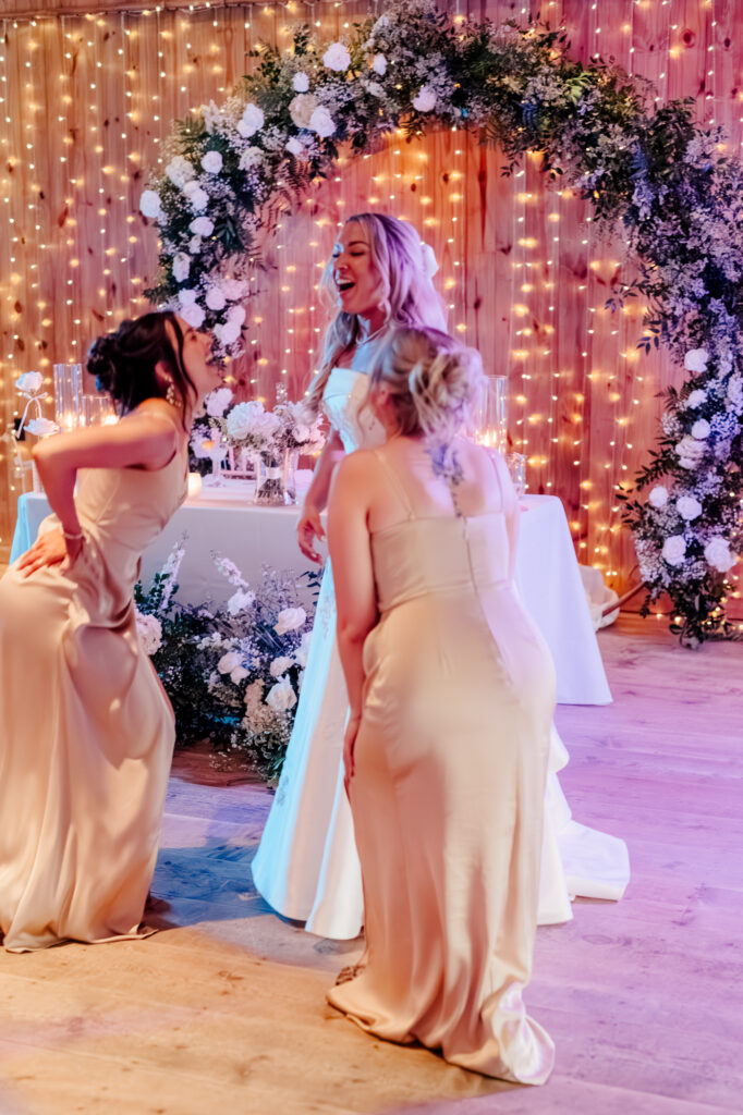 Anna & her bridesmaids on the dance floor at her wedding reception at Jorgensen Farms