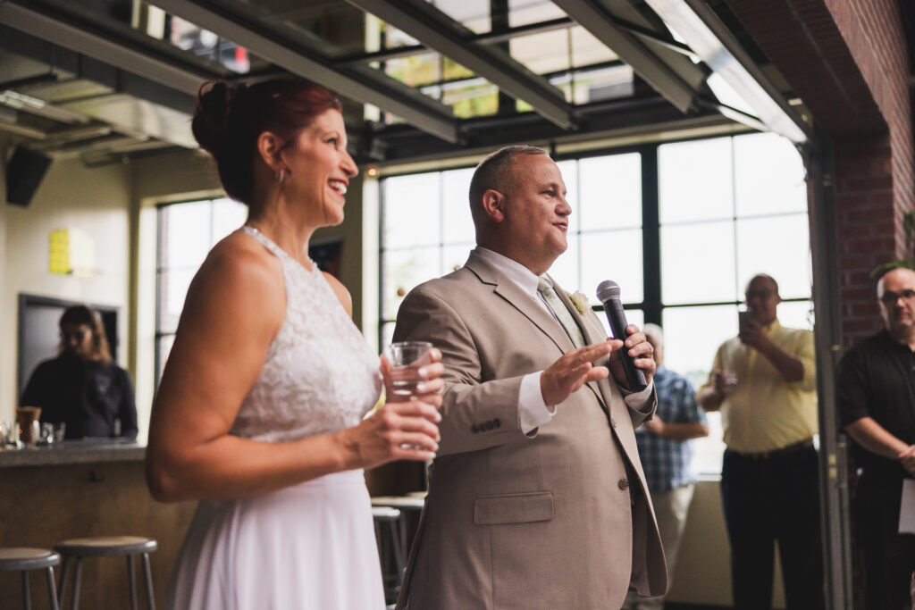 Ryan makes a speech right outside of the bar, following the Wedding Ceremony in the Sunroom at Seventh Son Brewing in Columbus, Ohio