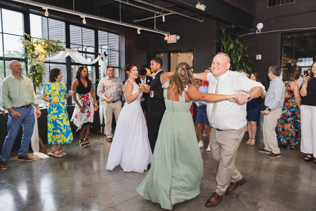 Susan, Ryan, and their family on the dance floor at Seventh Son Brewing in Columbus, Ohio