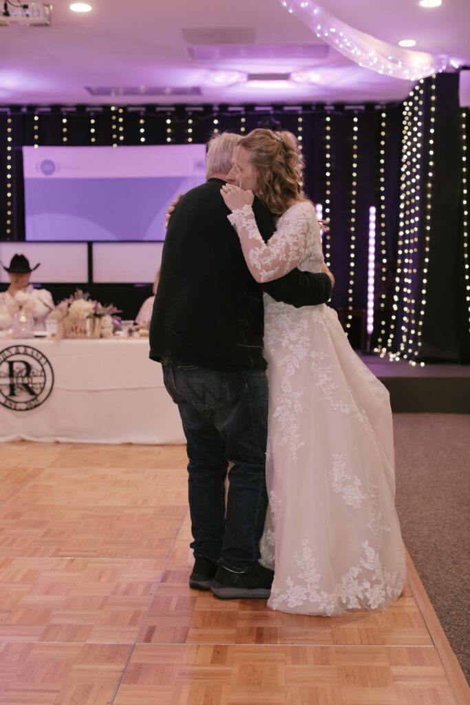 Kasey shares a dance with her dad during her wedding reception at the Grove By The River in Newark, Ohio