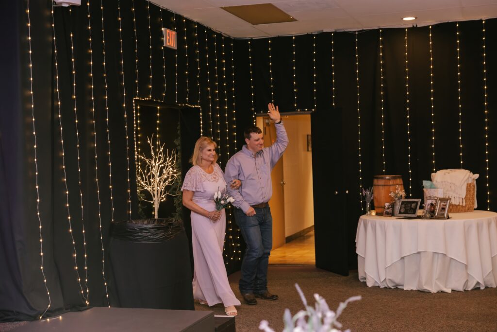The matron of honor and best man entering Kasey & John's Wedding Reception at The Grove By The River in Newark, Ohio