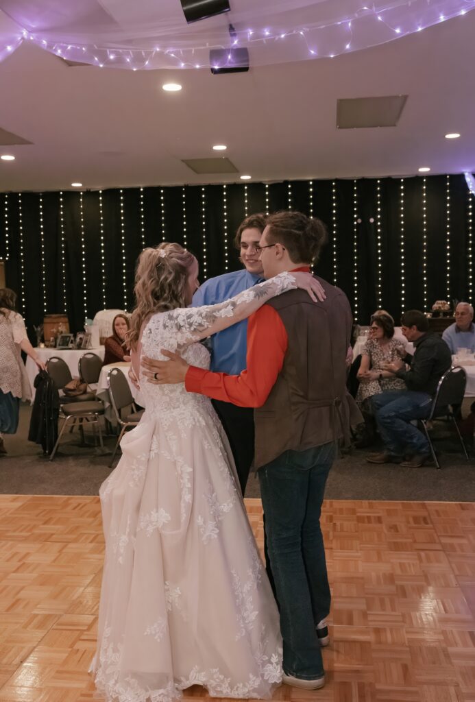 Kasey shares a dance with her sons during her wedding reception at The Grove By The River in Newark, Ohio