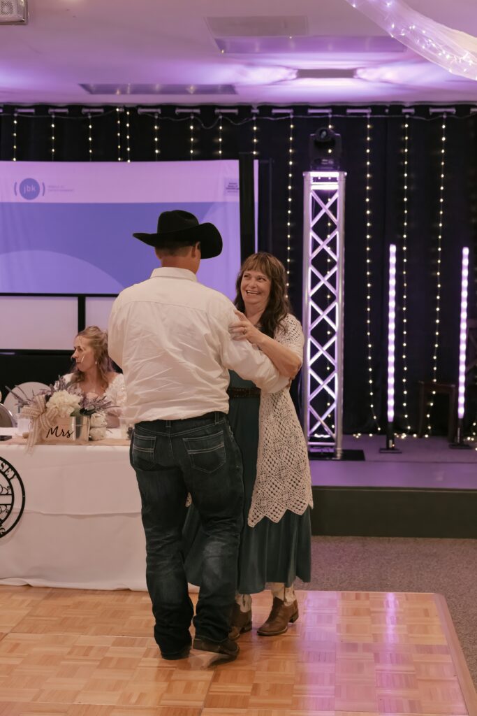 John shares a dance with his Mom during his wedding reception at The Grove By The River in Newark, Ohio