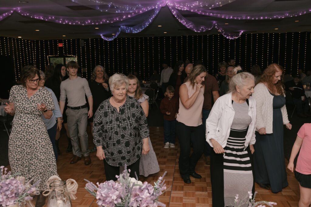 Kasey & John's guests having a great time on the dance floor during their wedding reception at The Grove by the River.