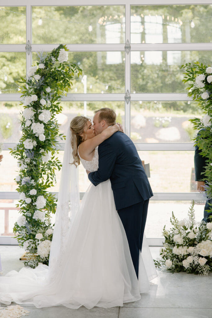 Allison & Joe seal their vows with a kiss during their wedding ceremony at Williams Farm in Pataskala, Ohio