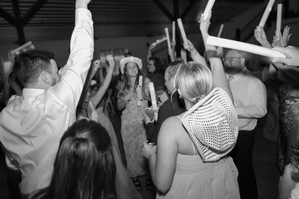 Guests on the dance floor with light sticks in the air at Joe & Allison's Wedding Reception in Pataskala, Ohio