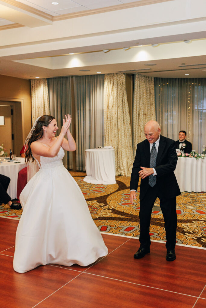 Ann & her Dad making their way to the dance floor for the Bride/Father Dance during her wedding reception at the Granville Inn in Granville, Ohio