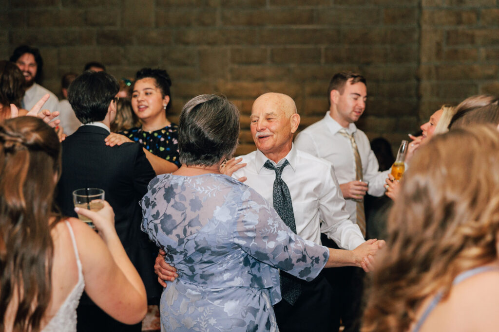 Friends and family on the dance floor at Ann & Bryse's Wedding Reception at Granville Inn in Granville, Ohio