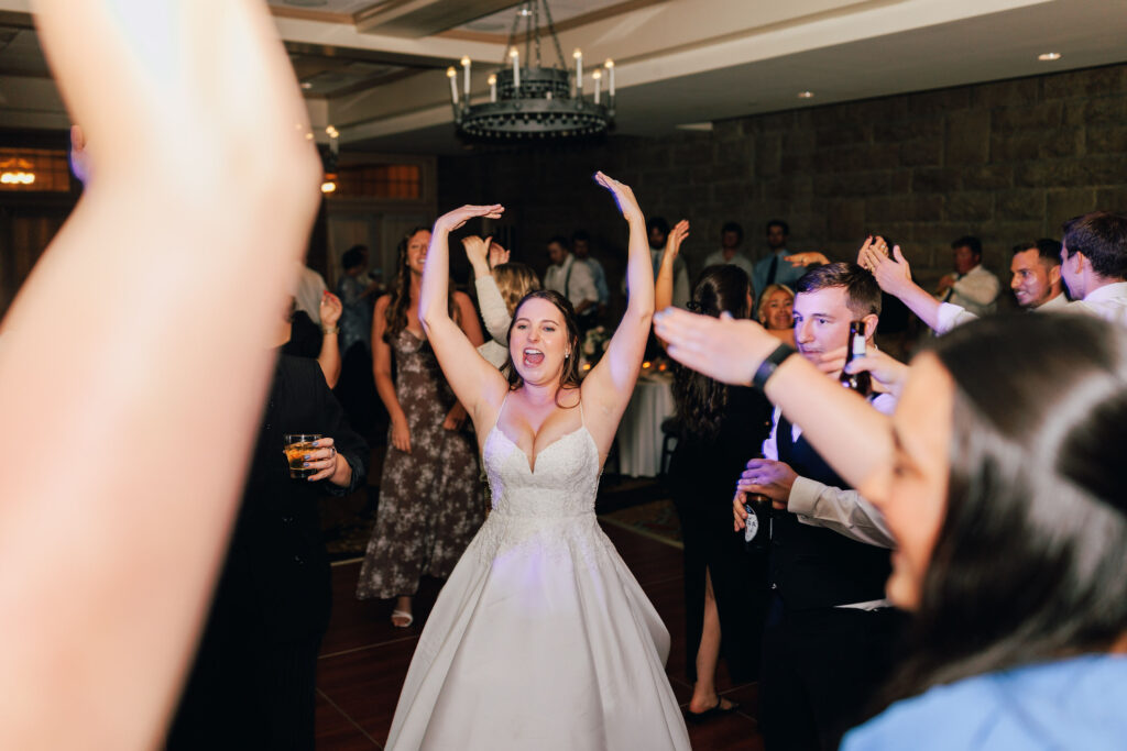Everyone singing along on the dance floor at Ann & Bryse's Wedding Reception at Granville Inn in Granville, Ohio