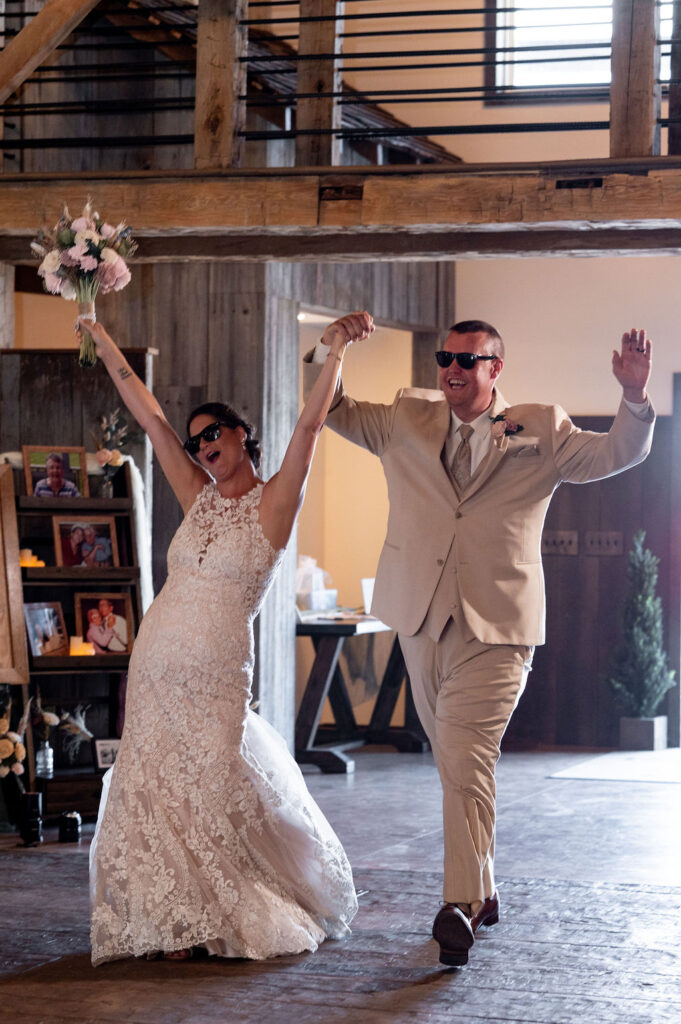 Sarah & Ryan enter their wedding reception at The Old Barns at Dry Run Farms in Williamsport, Ohio