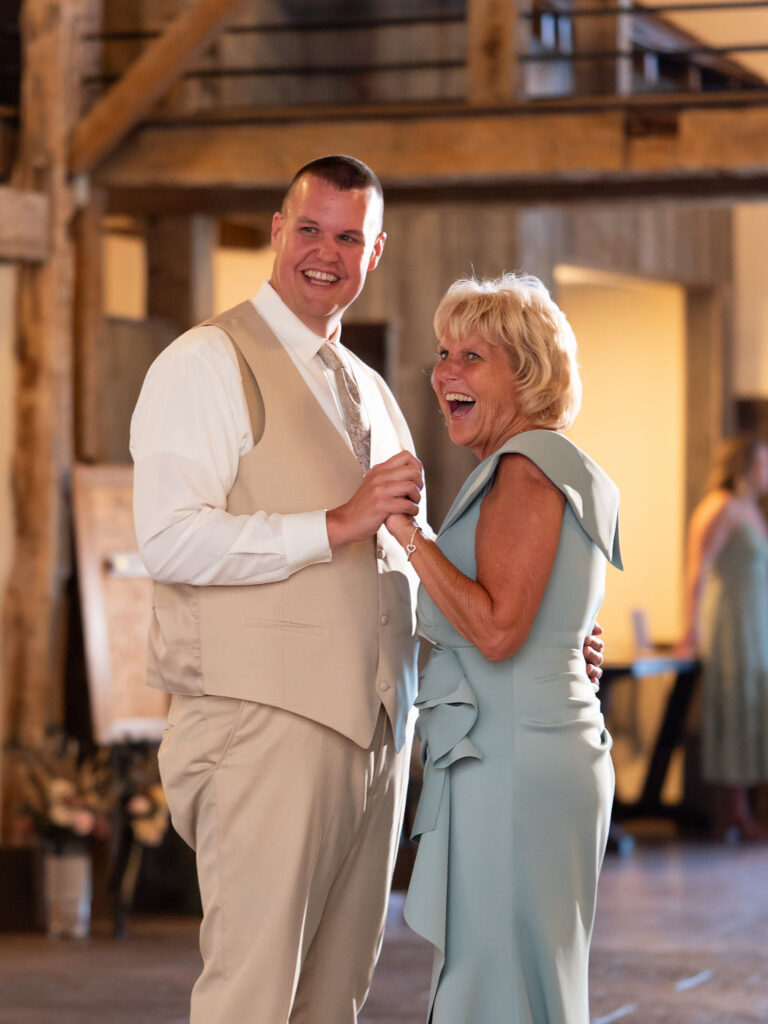 Ryan sharing a dance with his mom during his wedding reception at The Old Barns at Dry Run Farms in Williamsport, Ohio