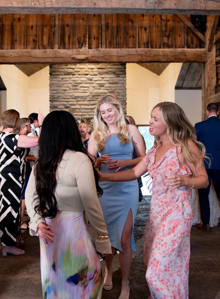Guests on the dance floor at Sarah & Ryan's Wedding Reception at The Old Barns at Dry Run Farms