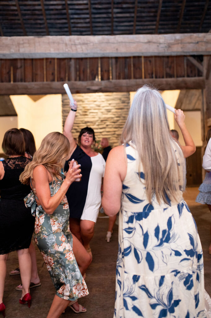 Guests dancing at Sarah & Ryan's Wedding Reception at The Old Barns at Dry Run Farms