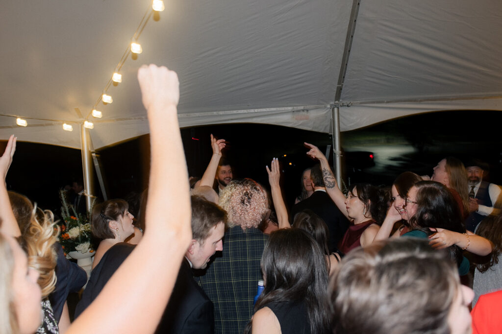 Hands are in the air at Carly & Roy's Wedding Reception in Granville, Ohio