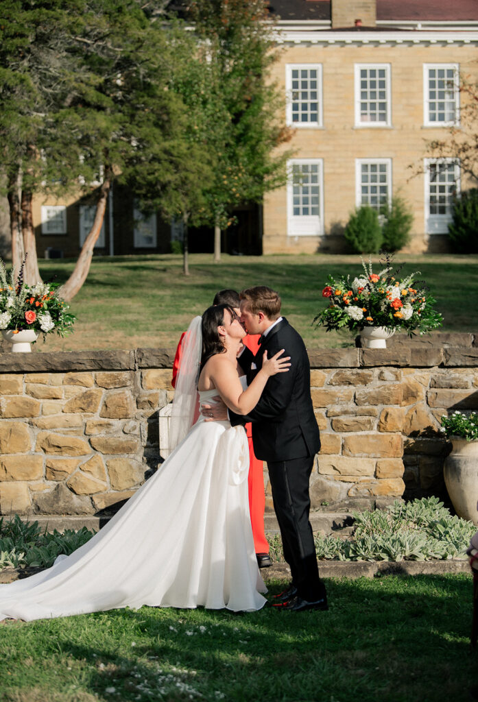 Carly & Roy seal their vows with a kiss at their wedding ceremony in Granville, Ohio