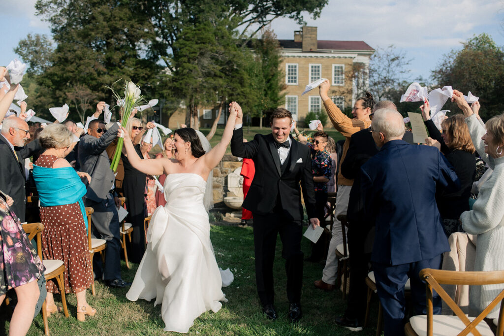 Carly and Roy walking back up the aisle during the recessional at their wedding ceremony in Granville, Ohio