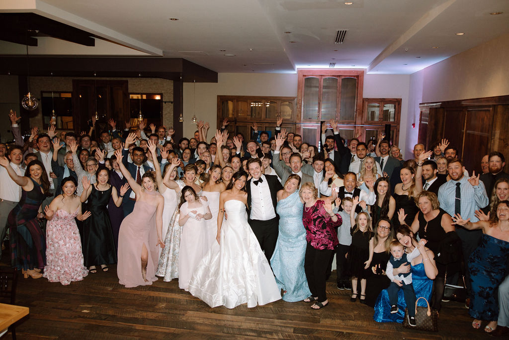 Shannon & Brady surrounded by all of their friends and family at their wedding reception at The Club at Corazon