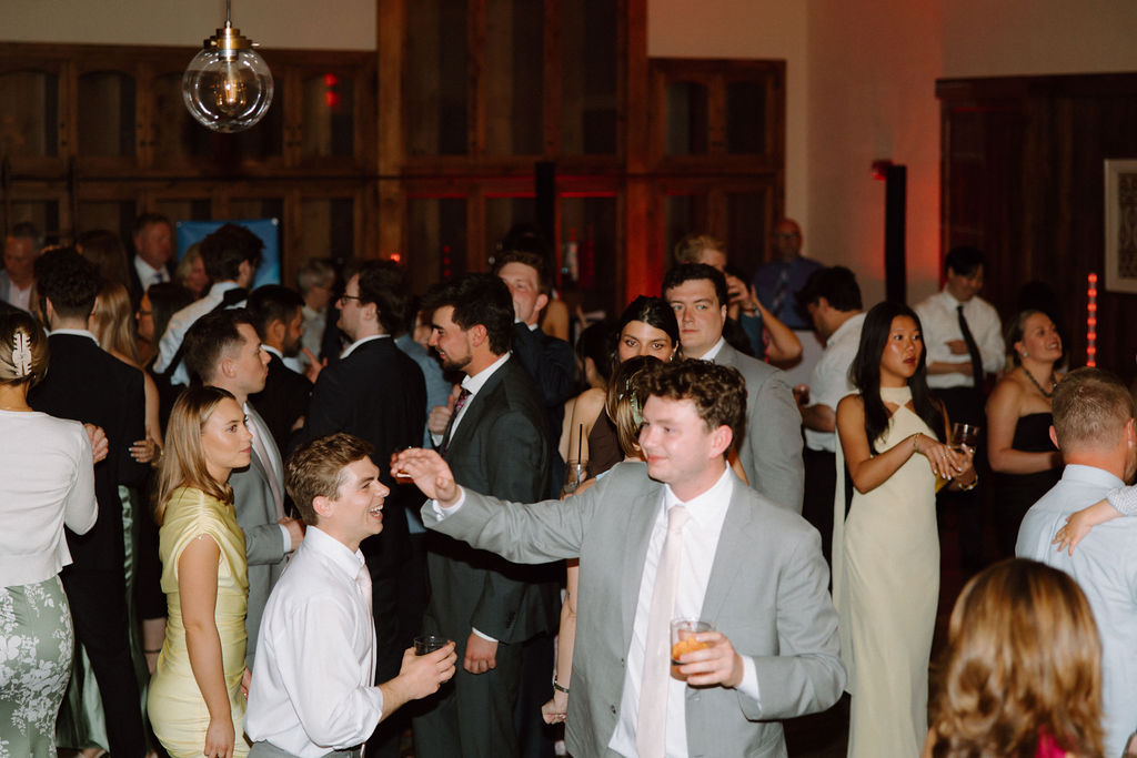 Shannon & Brady's guests on the dance floor at their wedding reception at the Club at Corazon in Dublin, Ohio