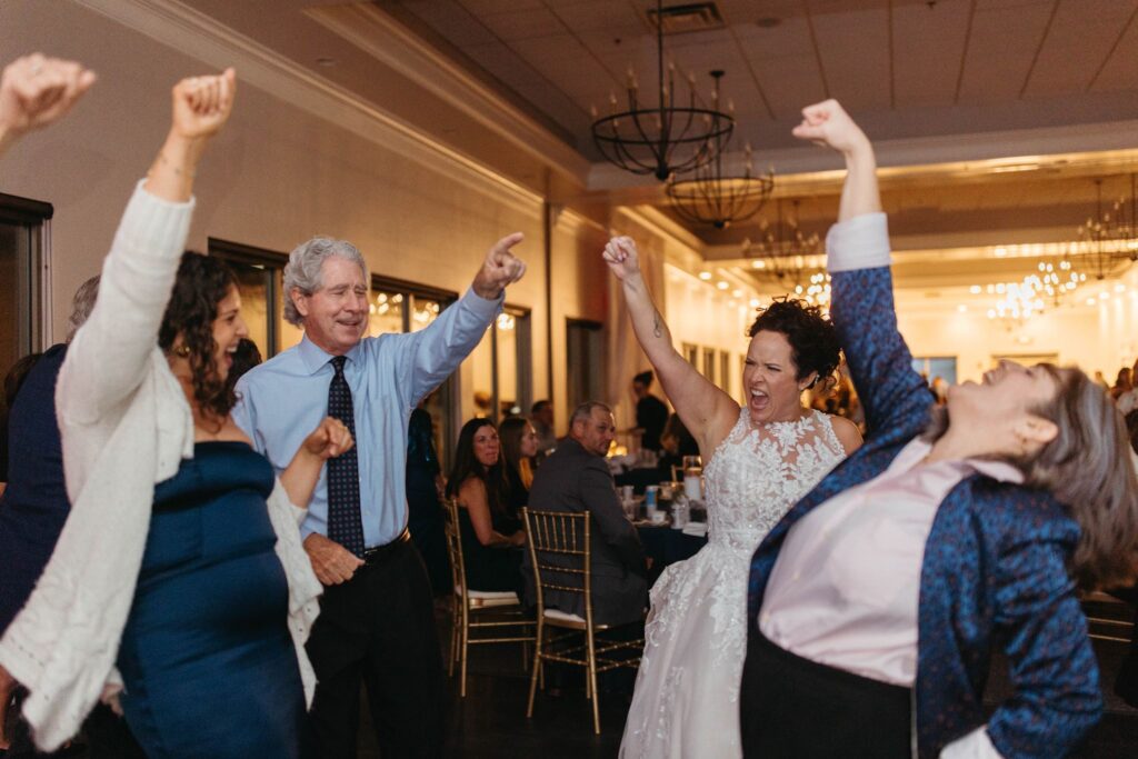 Heidi and her guests on the dance floor at her wedding reception at The Wenbeck Wedding & Events Center