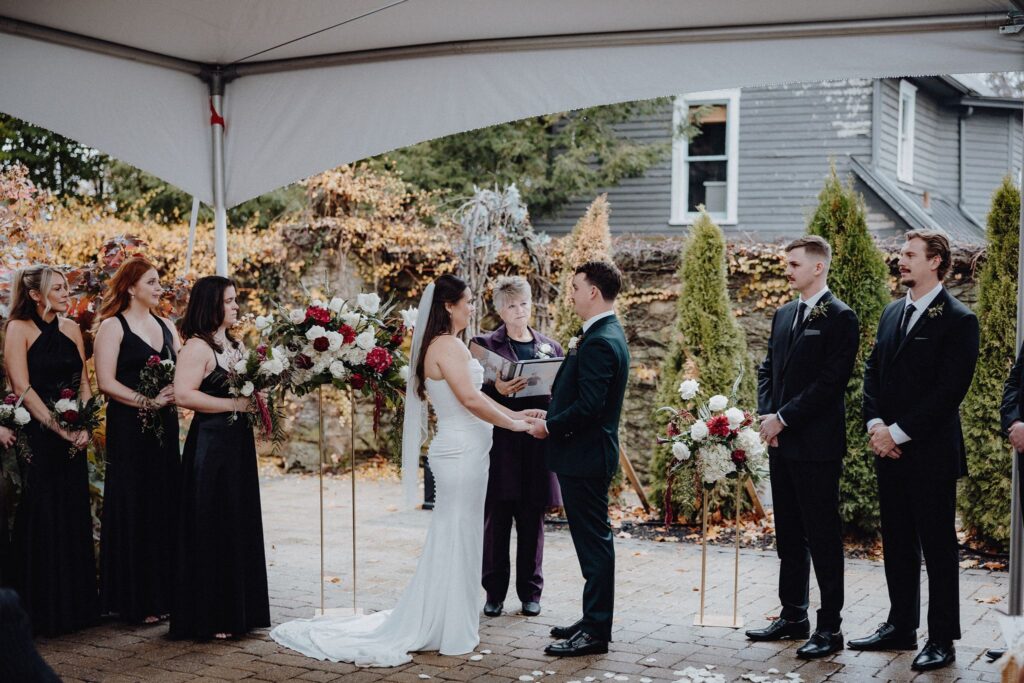 Morgan & Jonny exchanging vows during their wedding ceremony at Granville Inn in Granville, Ohio