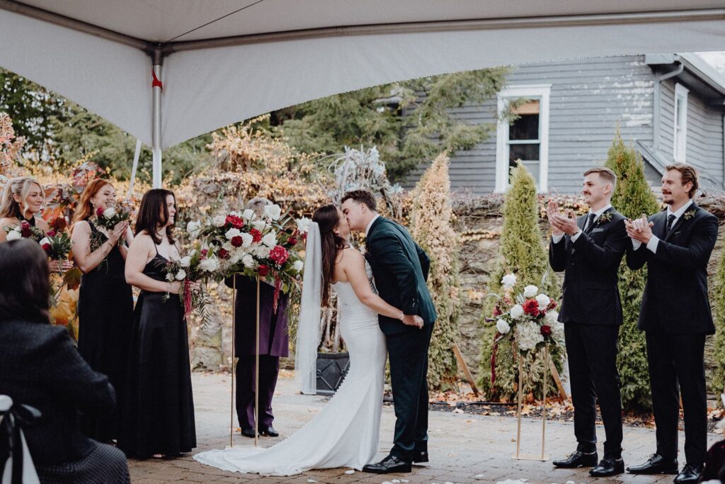 Morgan & Jonny seal their vows with a kiss at Granville Inn in Granville Ohio