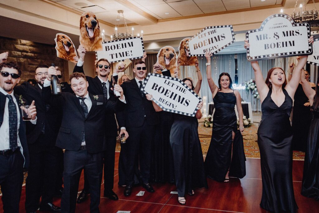 The wedding party gathered on the dance floor waiting to welcome the bride & groom in the Denison Room at Granville Inn