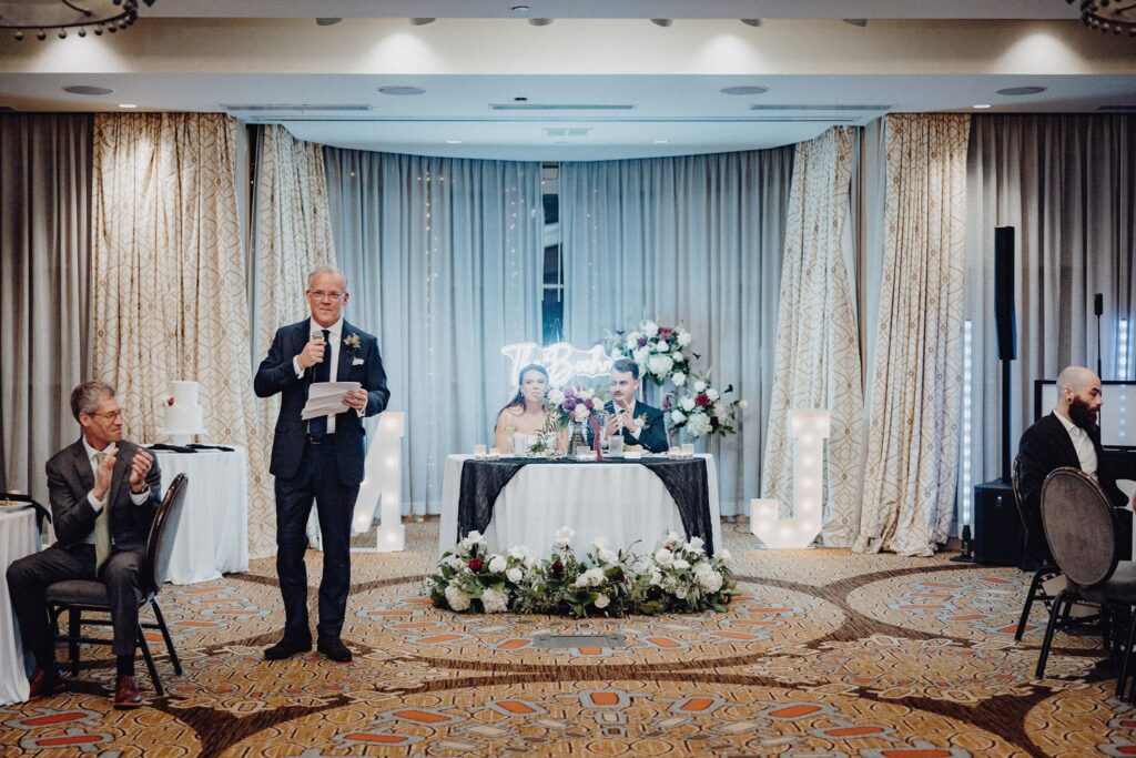 Morgan's Dad welcomes guests to open the wedding reception in the Denison Room