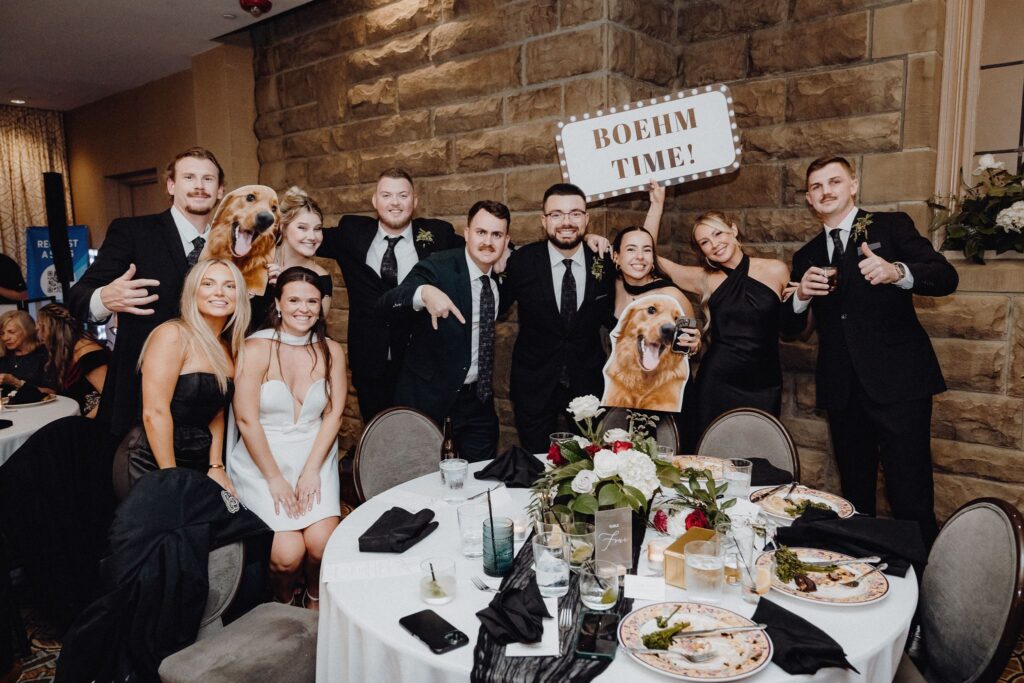 Morgan & Jonny take pictures with their guests for the photo dash at their wedding reception in the Denison Room