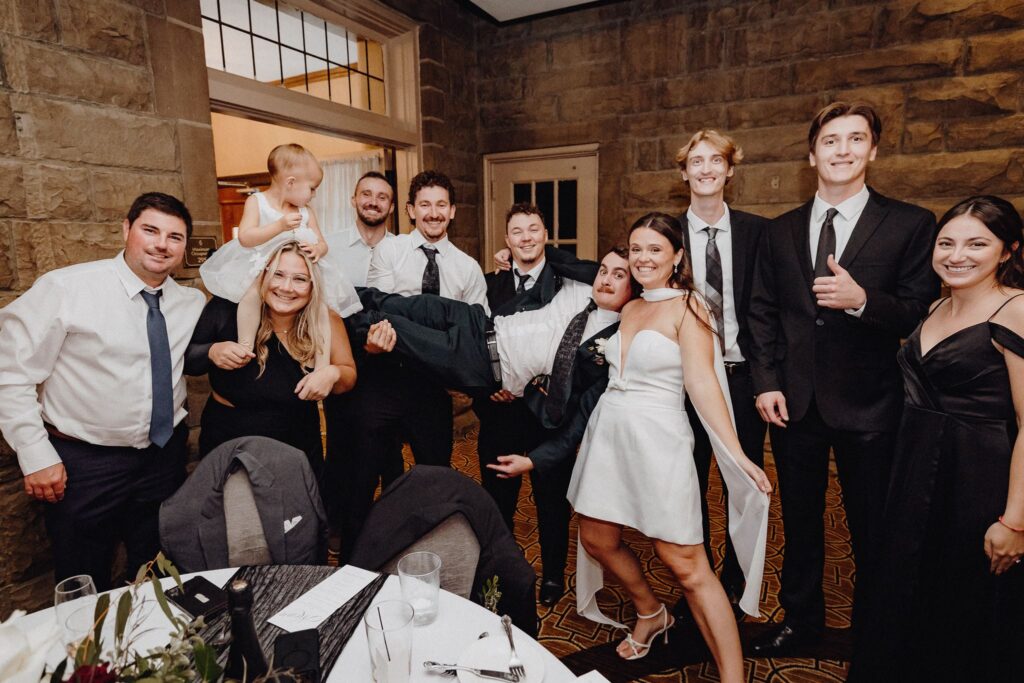 Jonny is in the air for the photo dash during the wedding reception inside the Denison Room at Granville Inn