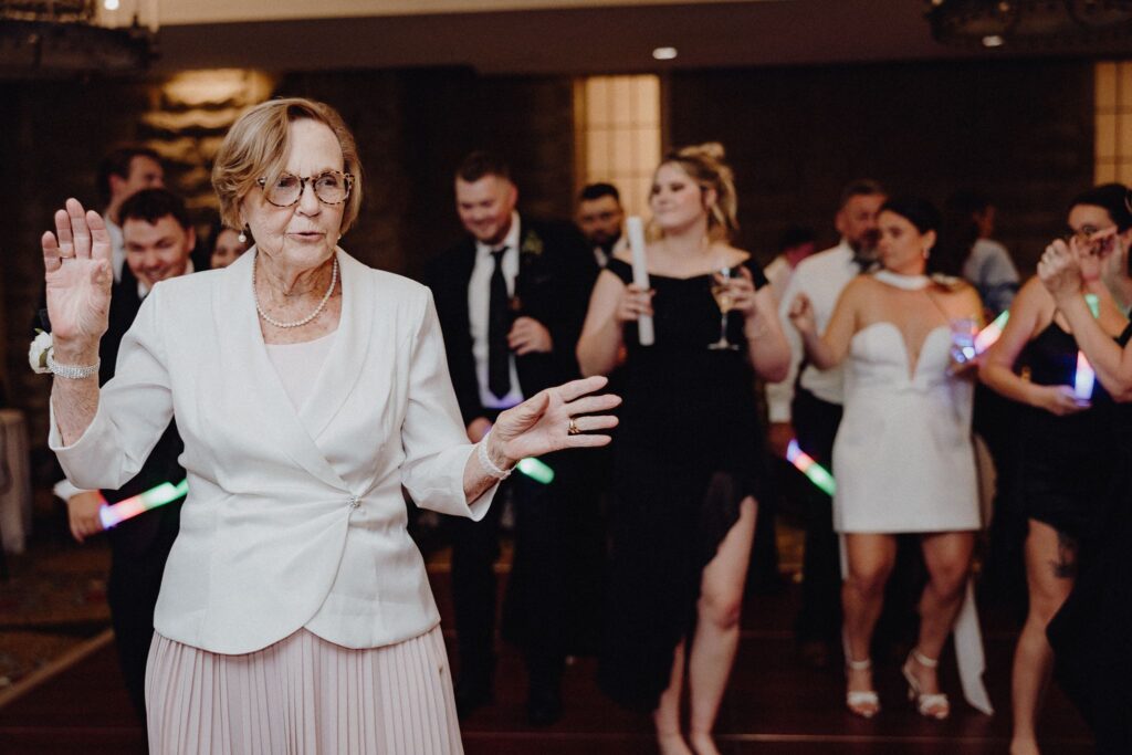Morgan, Jonny, and their guests dancing during their wedding reception at Granville Inn